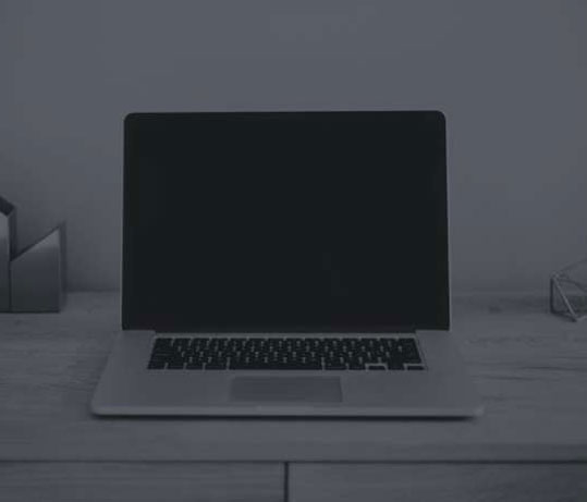 black and white image of a laptop